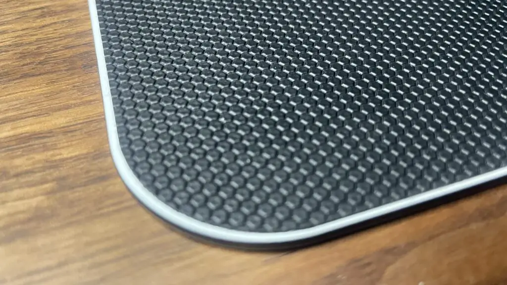 A close-up of the micro-textured surface of the QPAD Obsidian Glass.