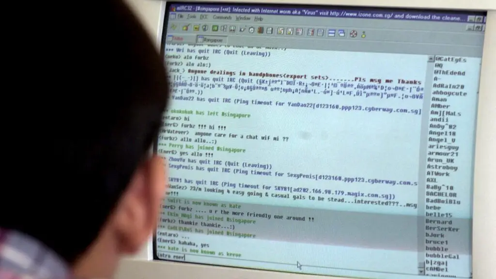 A man chats online using an Internet Relay Chat program logged onto an Internet chatroom in Singapore, 07 August 2000.