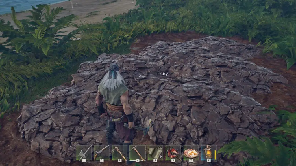 A clay deposit in Windrose showing a muddy patch of dirt distinct from grass.