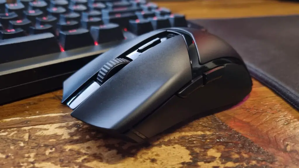 A Razer Cobra HyperSpeed gaming mouse on a desk, shot from the front