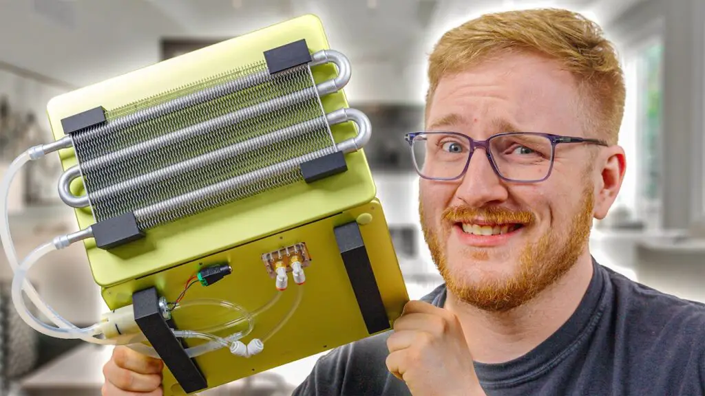 YouTubers Jakkuh and Zip Tie Tech standing with their modified MacBook Neo