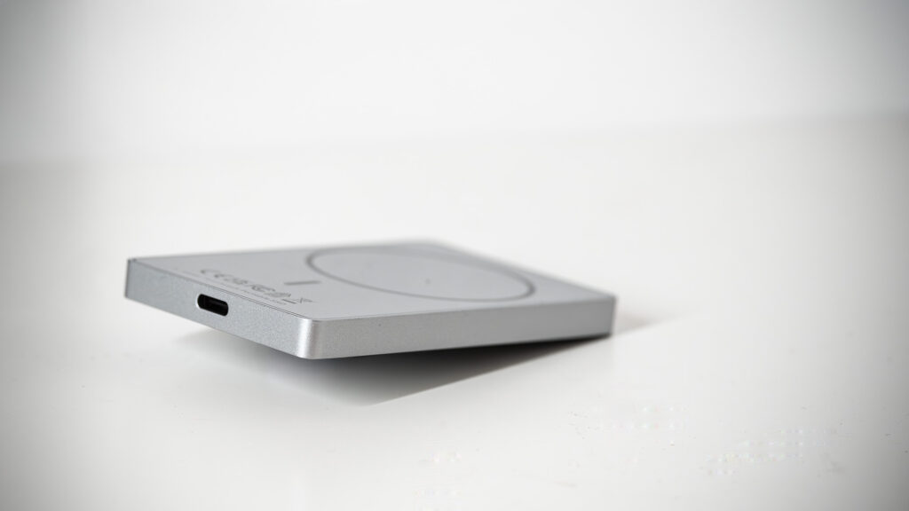 Lexar TouchLock Portable SSD on a white table with a phone.
