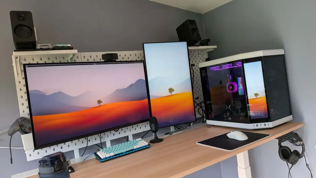 A high-end gaming PC setup on a desk with RGB lighting