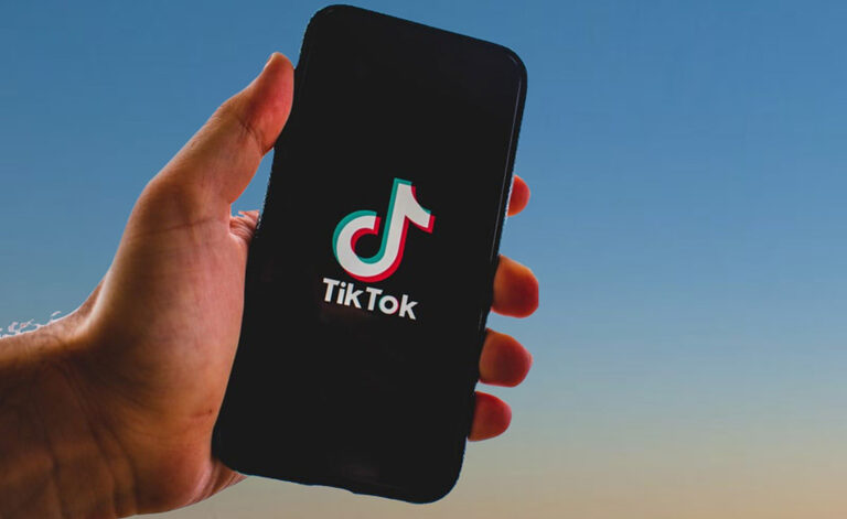 A user browsing TikTok on a smartphone screen