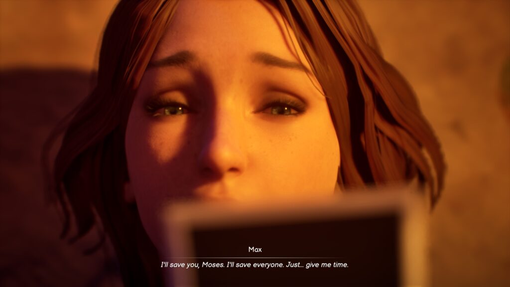 Max looking at a Polaroid photograph, with a sad look and a furrowed brow.