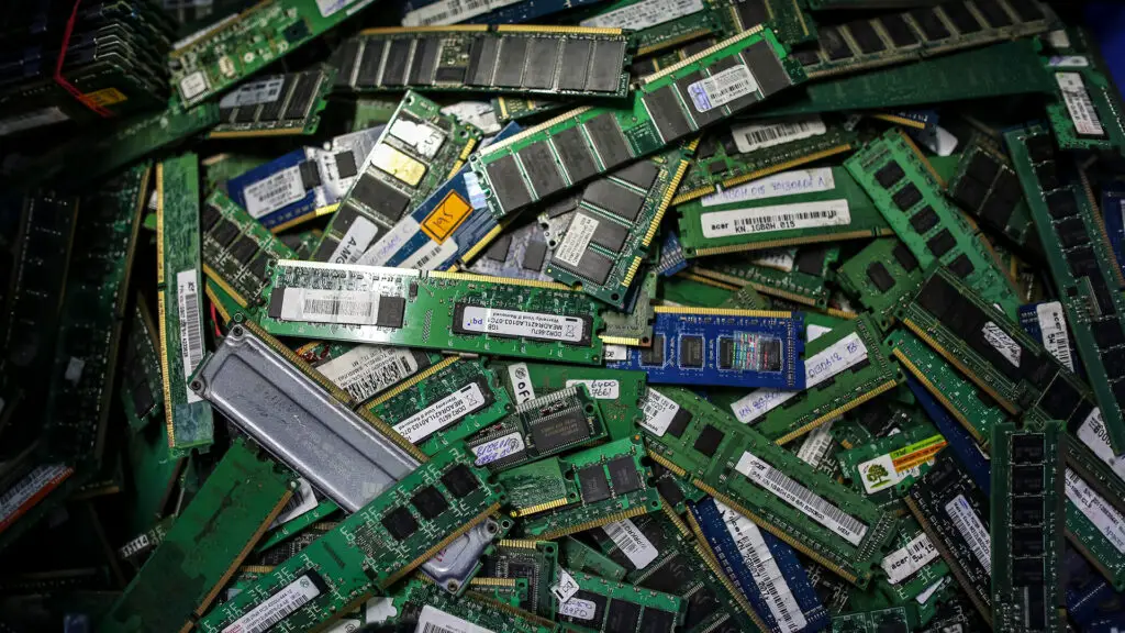 Scrapped Random Access Memory (RAM) devices in a recycling bin.