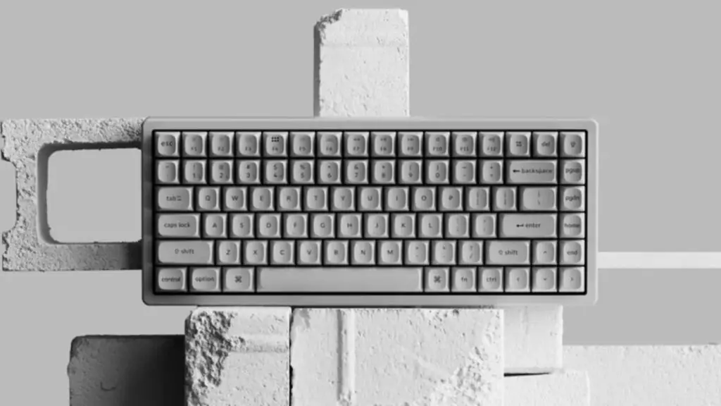 The Keychron K2 HE Concrete Edition showcased alongside raw concrete blocks