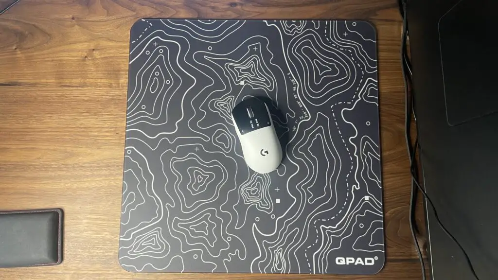 A top-down view of the QPAD Obsidian Glass mouse pad showing its sleek finish.