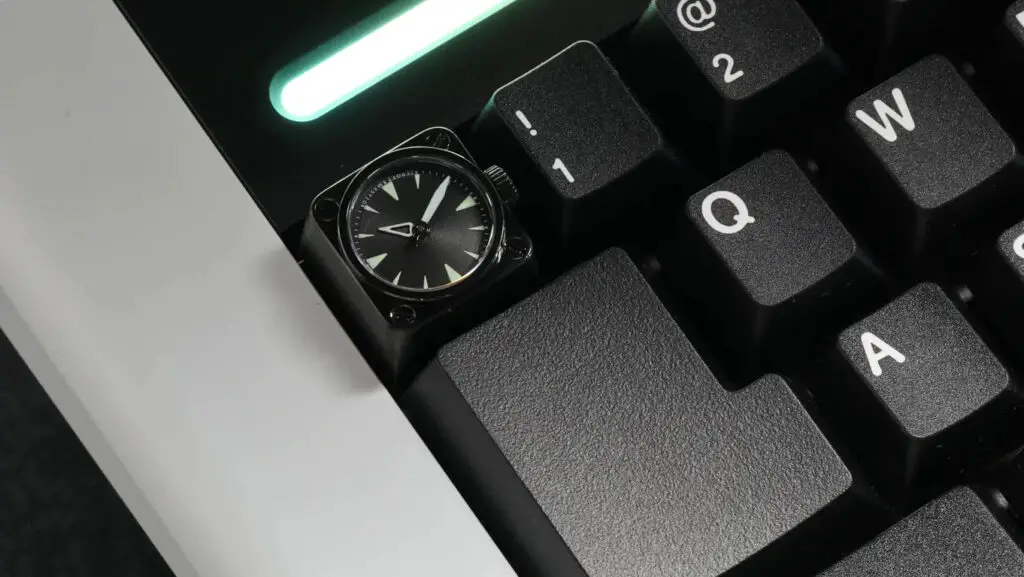 A Miyo keycap that includes a tiny watch face.