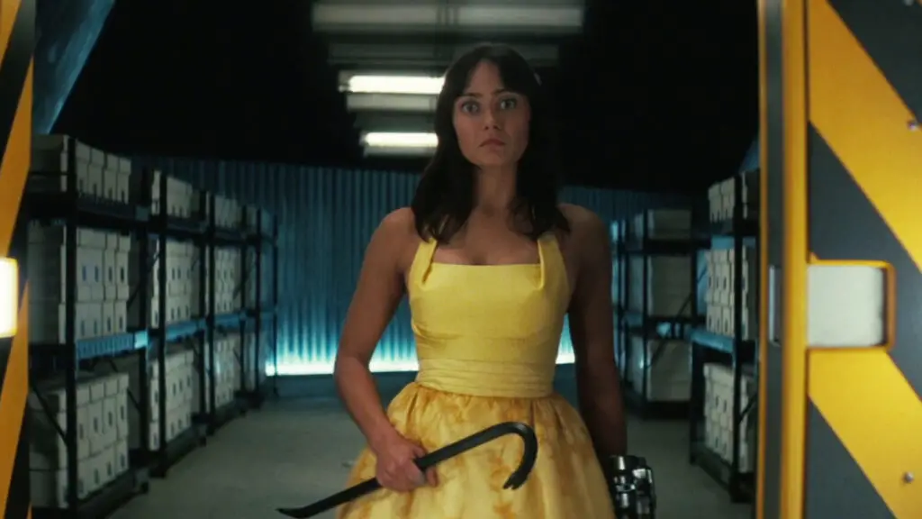 Lucy holding a crowbar in the wasteland