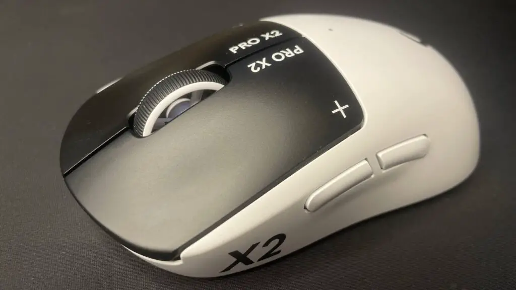 A Logitech G Pro X2 Superstrike gaming mouse on a desk