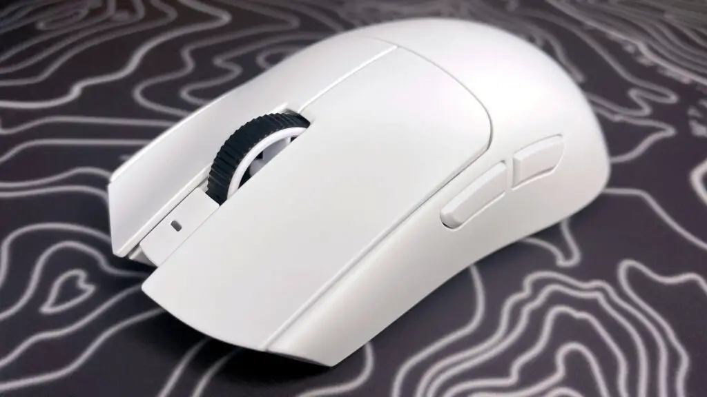 A photo of a white Razer Viper V4 Pro wireless gaming mouse on a colorful mouse pad