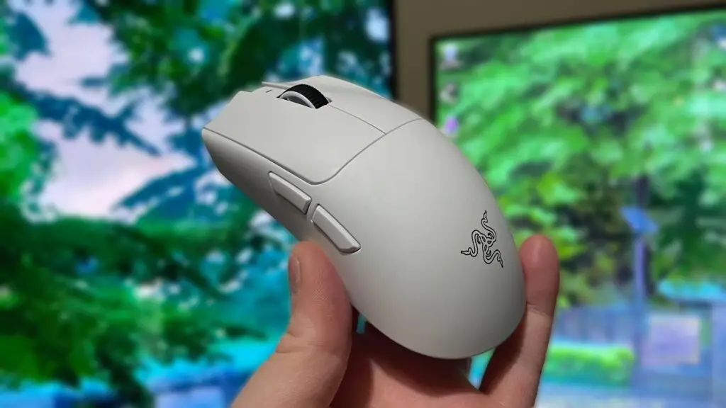 Holding a Razer Viper V4 Pro gaming mouse