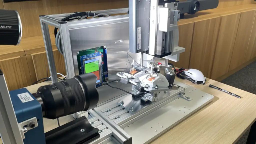 A bespoke high precision actuator machine at Logitech HQ used for testing click latency.