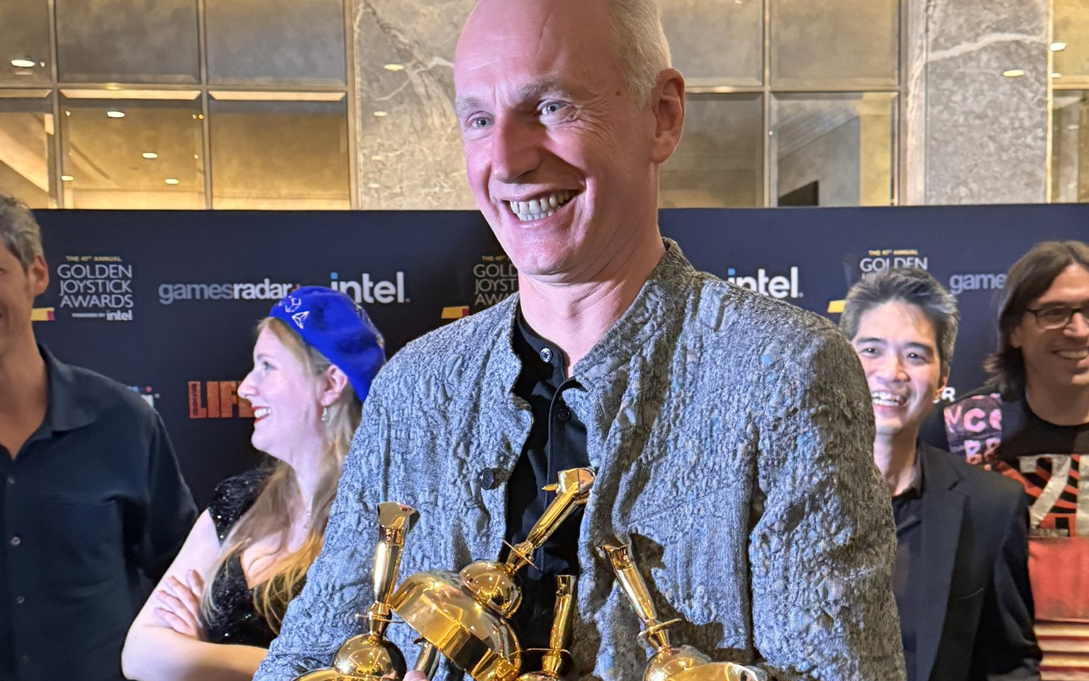 Swen Vincke holding multiple Golden Joystick Awards for Baldur's Gate 3